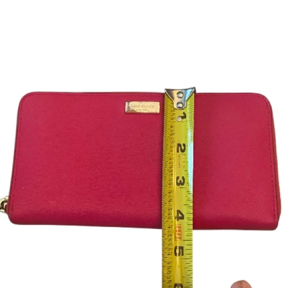 Kate Spade Newbury Lane Neda Wallet in Bougainvillea (pink).